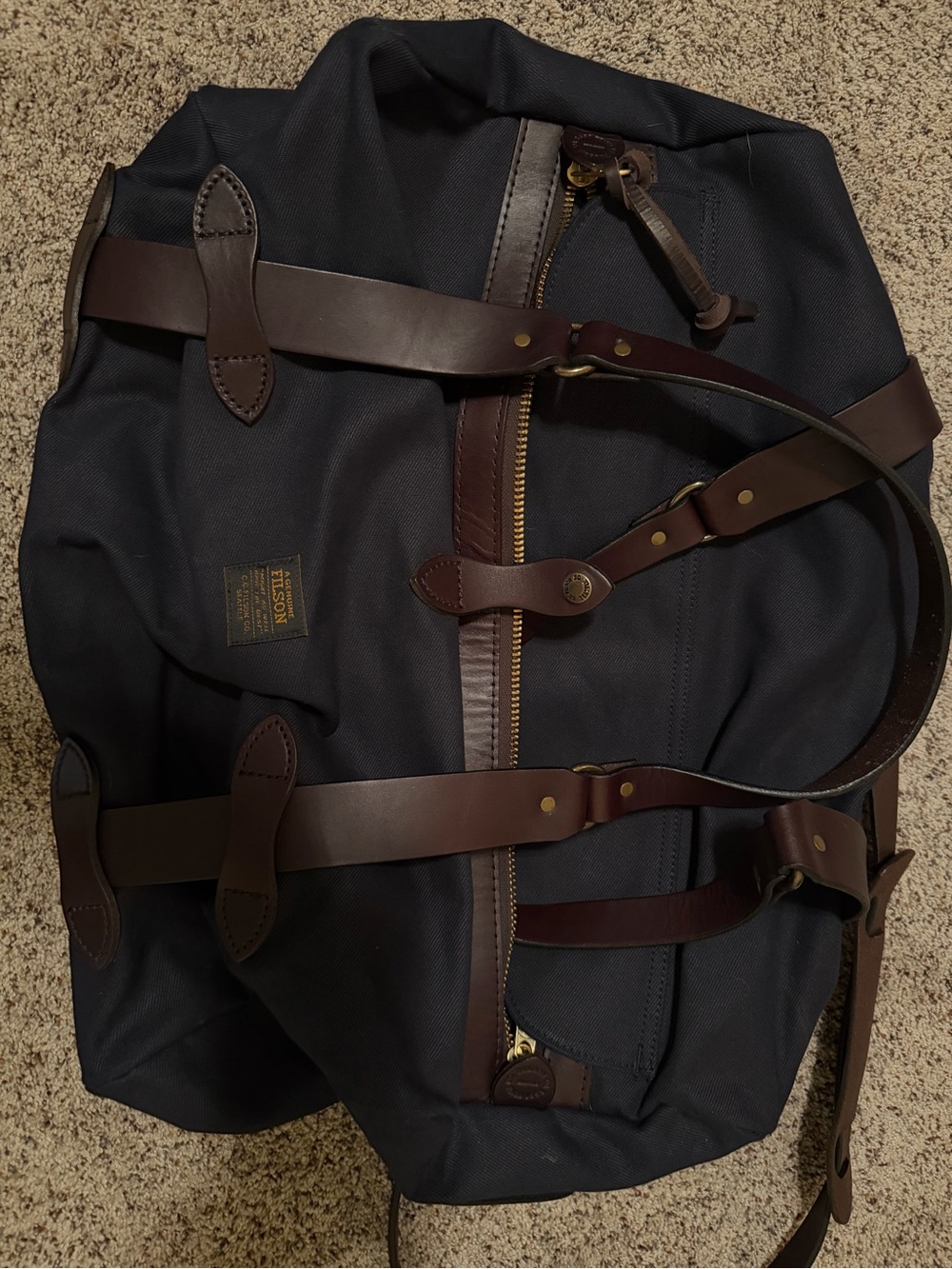 Filson Navy Duffel Bag with Brown Leather Trim and Brass Hardware